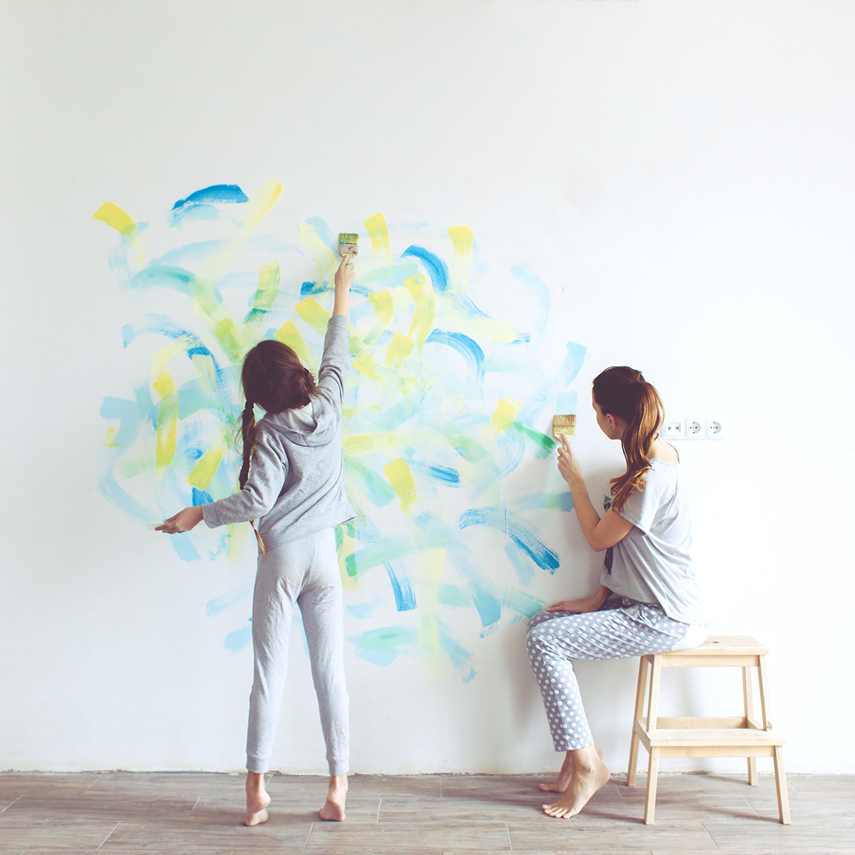 girls painting wall